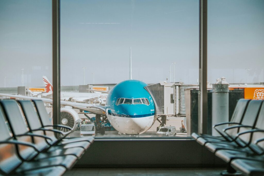 Airplane at the gate seen from an airport terminal