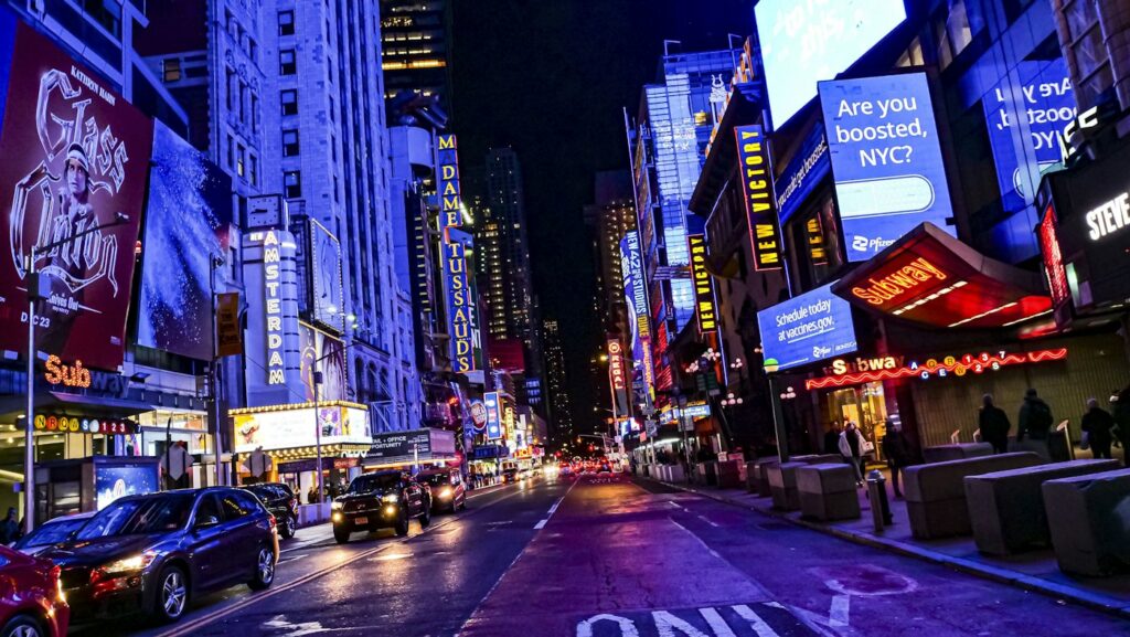 Times Square and Broadway lit up at night
